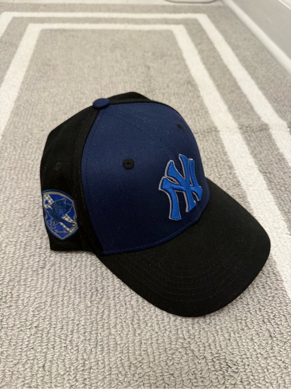 The New York Yankees 2024 SGA Harry Potter Ravenclaw Strapback Baseball Cap is a